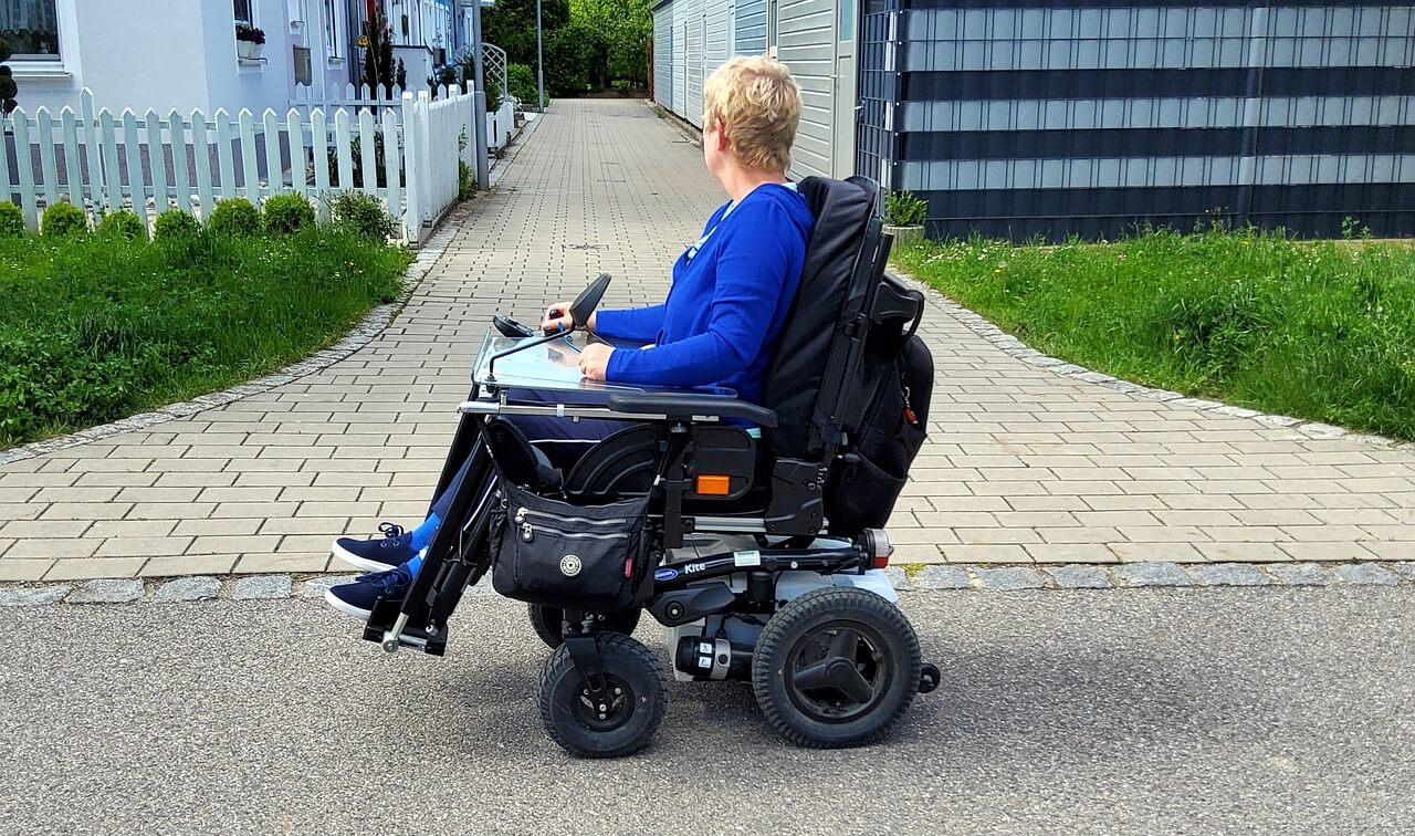 Person i rullstol